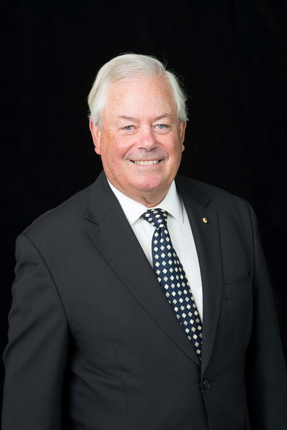 Corporate Portrait Photography | Melbourne Photography | Individual head and shoulders corporate portrait of man on black background