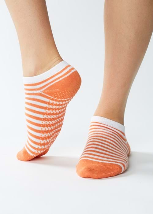 Product Clothing Photography | Melbourne Photography | Close up of woman wearing orange yoga socks on white background