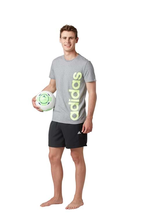 Product Clothing Photography | Melbourne Photography | Man carrying soccer ball wearing sports clothing on white background