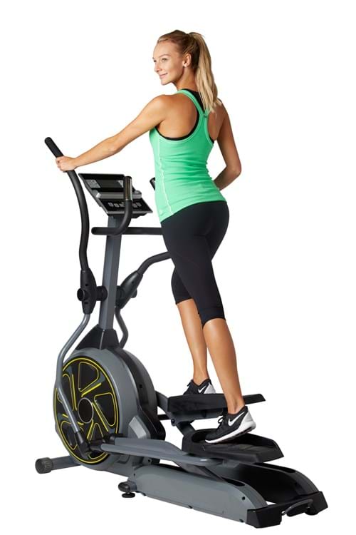 Product Clothing Photography | Melbourne Photography | Woman on exercise equipment wearing sports clothing on white background