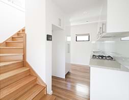 Commercial Photography | Melbourne Photography | Interior image of apartment kitchen and stairs